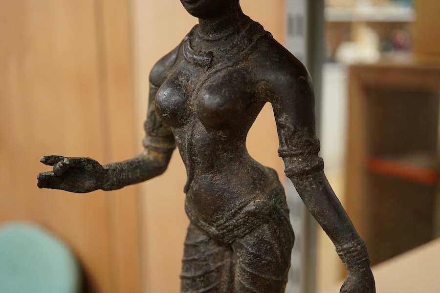 A South Indian cast iron figure of Parvati, 34cm high. Condition - fair